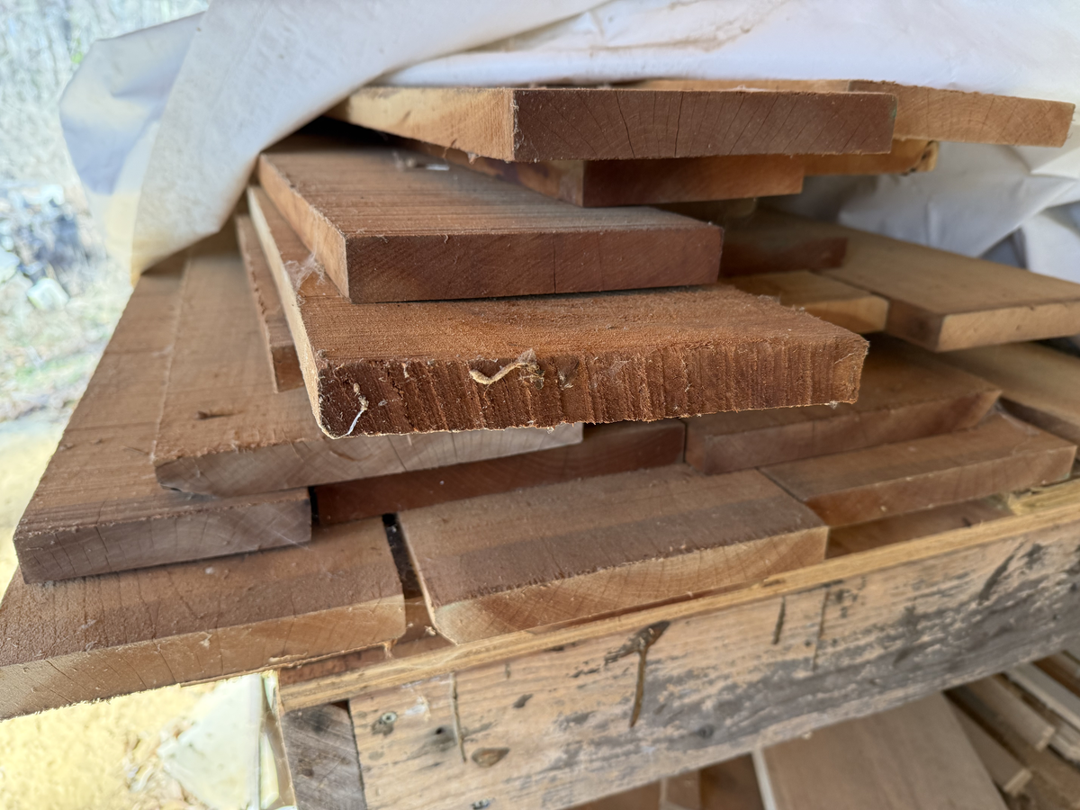 Premium hardwood lumber selected for custom woodworking